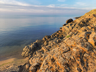 Rocky Black Sea coast in the rays of the setting sun,  Sinemorets, Bulgaria - 738050373