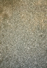 Background texture of a grey granite wall. Close up view
