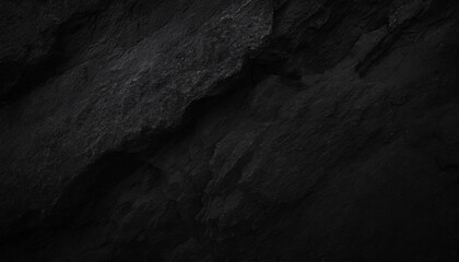 A close-up of dark, rugged rock textures, highlighting the intricate patterns and deep shadows, Ideal for backgrounds, nature themes, or abstract art.