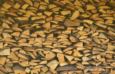 A lot of dry chopped firewood is stacked in the period of preparation for the furnace