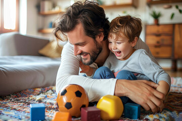 Fototapeta premium Father and young son share a joyful moment with soccer ball and colorful toys on the floor at home