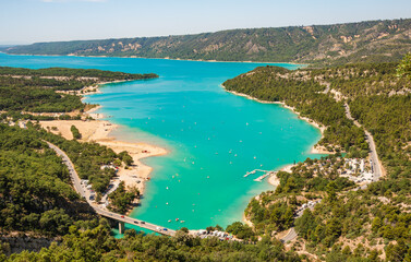 The Verdon Gorge and lake of Sainte Croix du Verdon in the Verdon Natural Regional Park, France panoramic view with kayaks and boats.  - 738068344