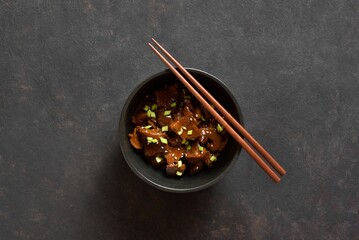 Beef with soy sauce, green onion and sesame seeds