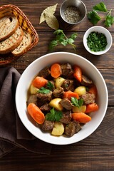Beef meat stewed with potatoes, carrots and spices