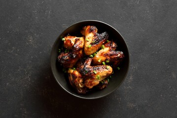 Grilled chicken wings in bowl