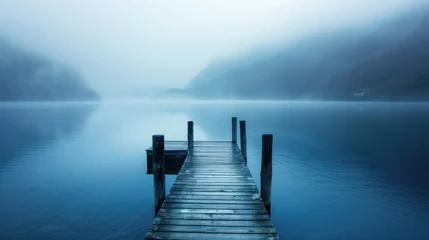 Foto op Plexiglas A quiet lake with a wooden pier disappears into mist. © ORG