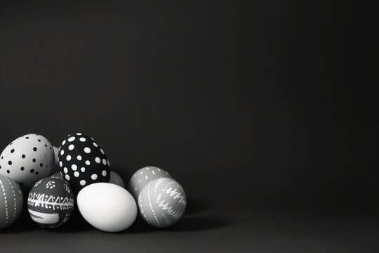 Monochrome photo of Easter eggs arranged on a black background