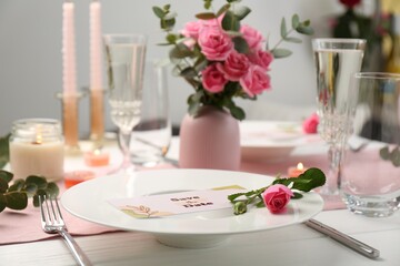 Romantic table setting with flowers and candles