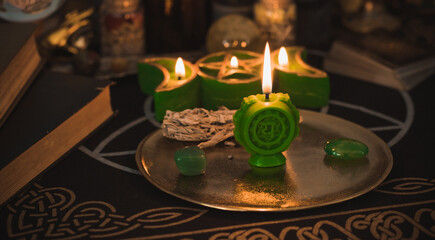 Healing of Anahata heart chakra. Green candles for mental health. Esoteric concept, cleaning of negative energy