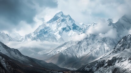 Obraz premium landscape of mountain peaks blanketed with pristine snow under a clear blue sky.