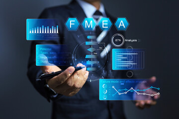 Businessman working with FMEA or failure mode and effect analysis to analyze cause of problem and...