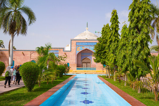 Tourists visit old Mosque in Thatta, Pakistan. Beautiful sunny day. 