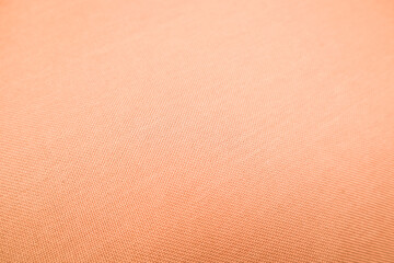 Light gradient paper backdrop, trendy peach fuzz color. Textures formed by cardboard or paper...