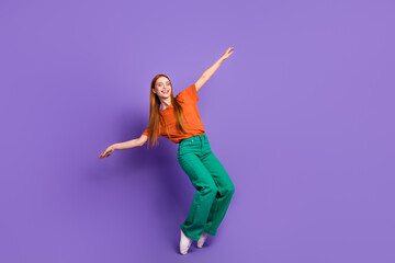 Fototapeta na wymiar Photo of adorable positive girl wear trendy clothes have fun good mood friday party isolated on purple color background