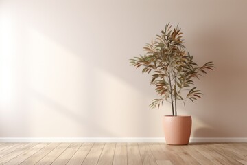A potted plant sits in front of a beige wall.