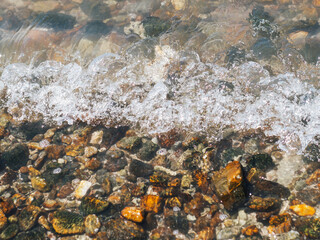 Stones on the beach, rocks on the beach, rocks on the coast, sunset on the beach, rocks and sea, close up of a lot of stones
