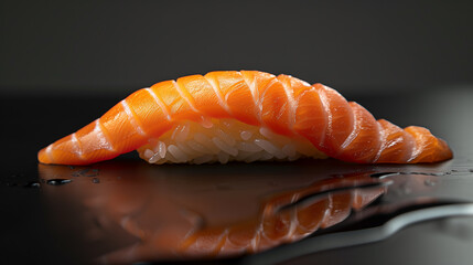 a close up of a piece of sushi on a black surface