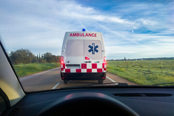 Driving behind an ambulance on local road © WH_Pics