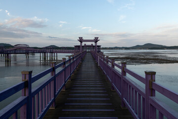 purple wooden bridge at the seaside