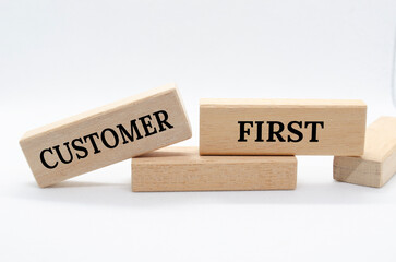 Customer first text on wooden blocks. Customer centric concept