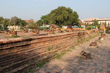 ruined temple (wat thammikarat) in ayutthaya in thailand
