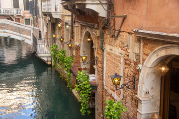 canal in venice italy, decorated with lights and plants