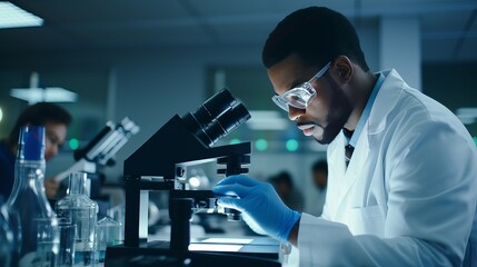 African scientist, medical worker, tech or graduate student works in modern biological laboratory - obrazy, fototapety, plakaty