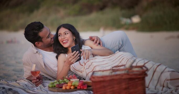 Happy couple, picnic and beach for selfie, photography or memory together on date, picture or outdoor bonding. Man and woman with smile in relax for photo or capture moment by fruit basket on blanket
