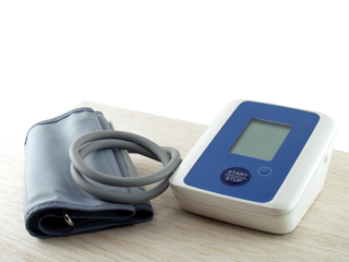 portable electronic blood pressure monitor on desk corner isolated on transparent