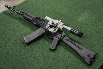 AK74m assault rifle with an optical sight at a shooting range.