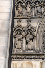 Fototapeta na wymiar Ornate Carved Stone Figures on the Side of a Cathedral in Edinburgh Scotland