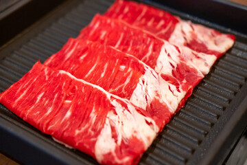 Close-up of sliced raw meat for hot pot