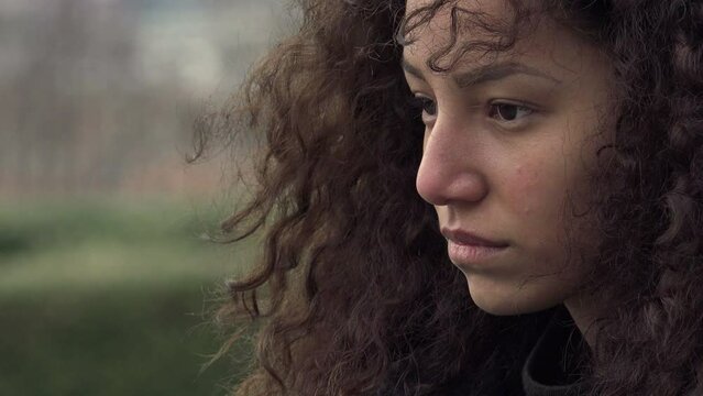 lost in her thoughts: beautiful young sad and lonely woman