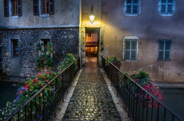 Cobblestone Street Leading to Building With Light On