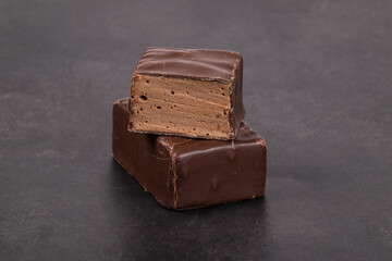 Vegan Candies. Chocolate souffle in chocolate. Dark gray background. Close-up