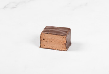 Chocolate souffle in chocolate. In the section. White background. Close-up