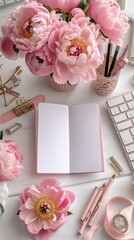 Pink flowers and a notebook on a white table