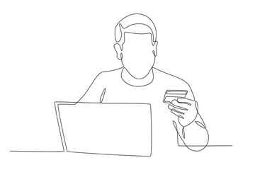 A man is using a debit card