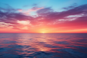 Naklejka na ściany i meble A beautiful sunset over the ocean with vibrant colors