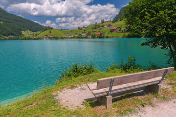 Naklejka na ściany i meble Lovely emerald green lake Lungerersee in Swiss Alps, canton of Obwalden, Switzerland
