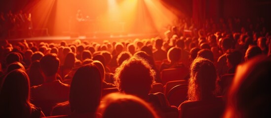Concert attendees with tickets or passes observe the performance.
