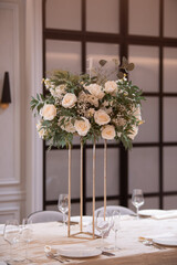 Luxury wedding table setting with flower centerpieces and candles