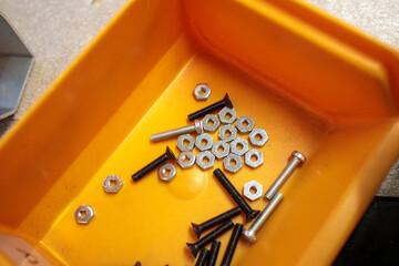 close up of a yellow box and screws