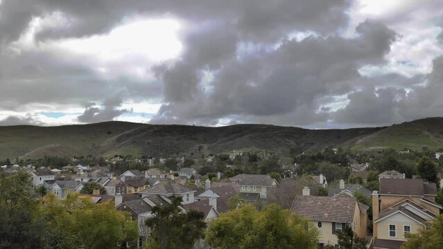 Running storm clouds over a small town in California
