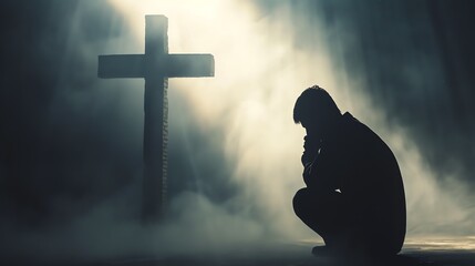 A person in devout prayer before a cross, with misty beams of light creating an ethereal atmosphere. This emotive image symbolizes faith, hope, and spirituality in moments of contemplation. - obrazy, fototapety, plakaty