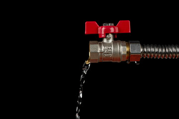 Water flows from a tap on a black background.