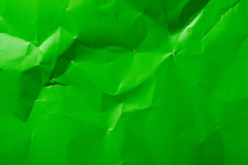 Green crumpled paper as a background.