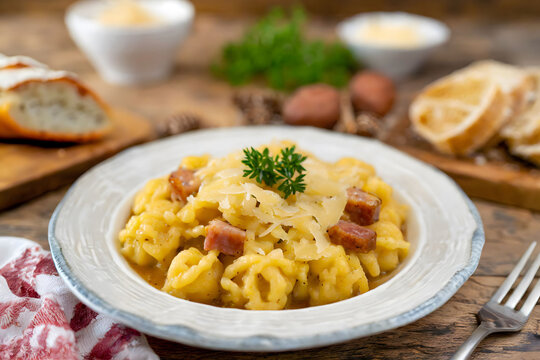 A delicious serving of traditional German Käsespätzle, garnished and ready to savor