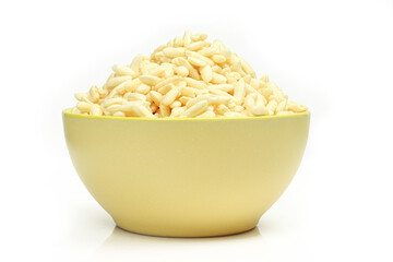 Full bowl of puffed rice isolated on white background