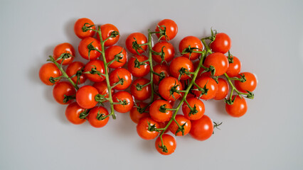Red cherry tomatoes on a branch, washed with water. Top view. - 738248387